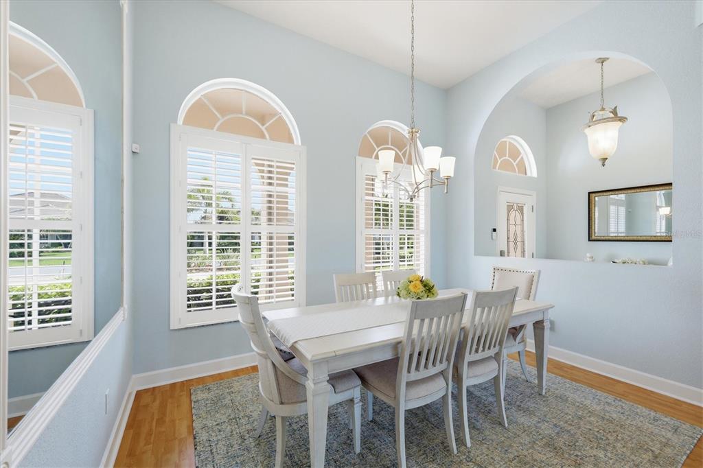 3606 Pennyroyal Road Port Charlotte, FL 33953 - Photo 24 of 96 a view of a dining room with furniture and windows
