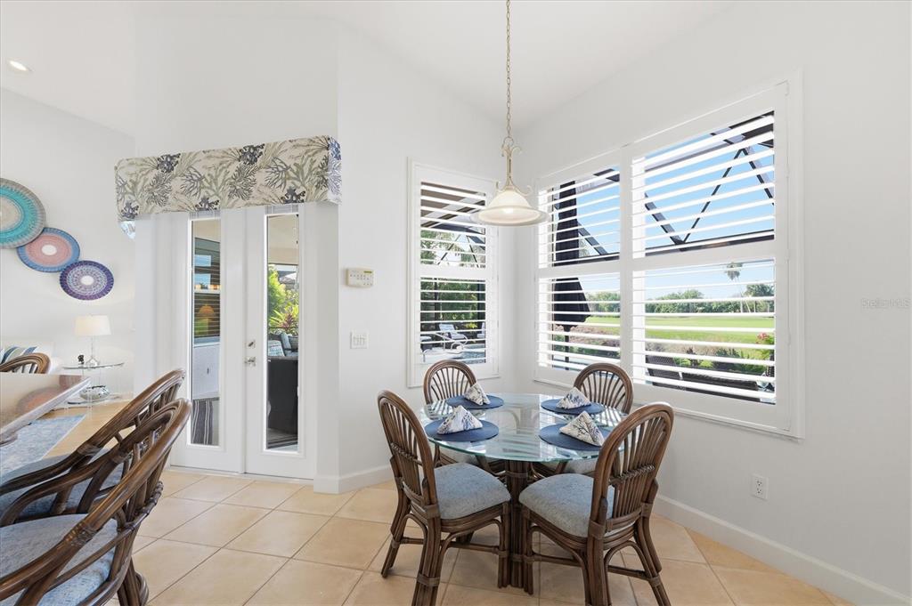 3606 Pennyroyal Road Port Charlotte, FL 33953 - Photo 30 of 96 a view of a dining room with furniture window and outside view