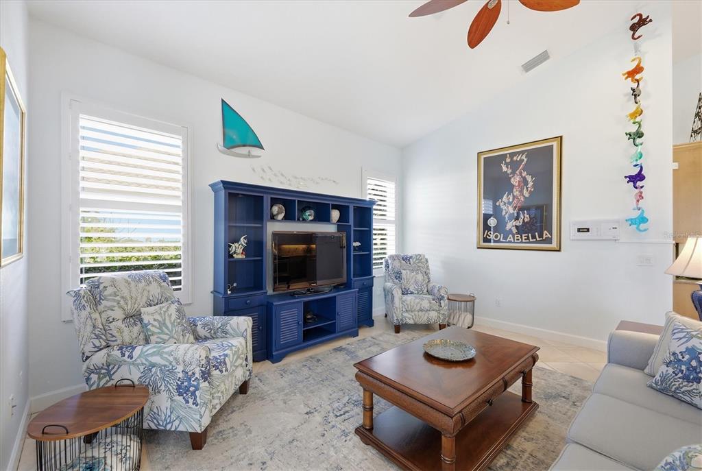 3606 Pennyroyal Road Port Charlotte, FL 33953 - Photo 33 of 96 a living room with furniture and a flat screen tv
