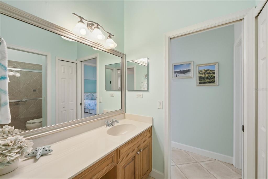 3606 Pennyroyal Road Port Charlotte, FL 33953 - Photo 42 of 96 a bathroom with a sink and a mirror