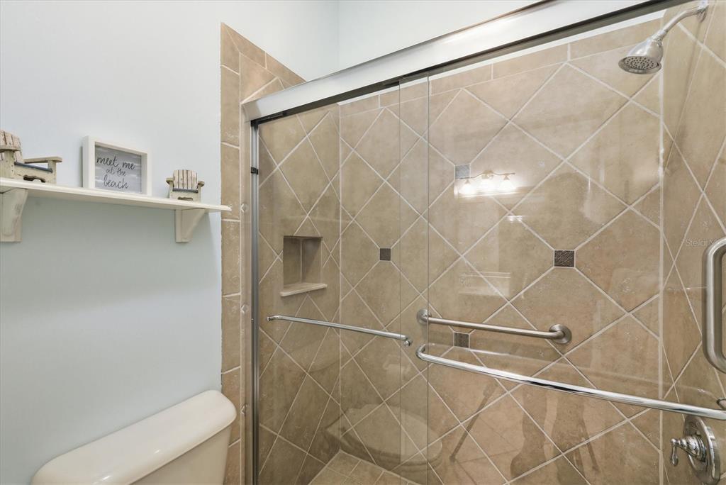 3606 Pennyroyal Road Port Charlotte, FL 33953 - Photo 43 of 96 a bathroom with a shower and a glass door shower