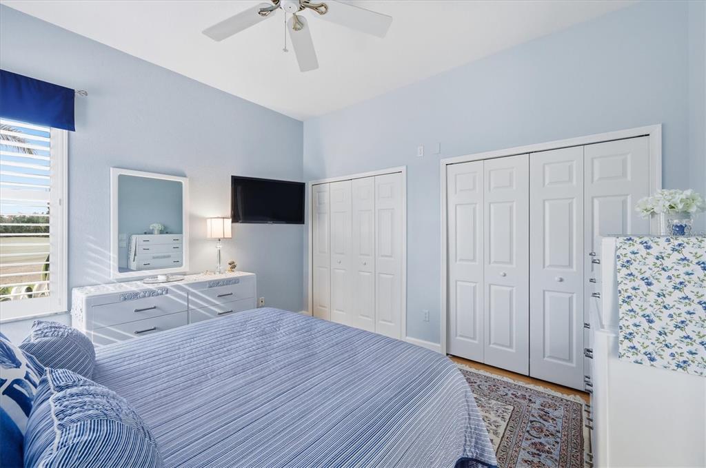 3606 Pennyroyal Road Port Charlotte, FL 33953 - Photo 44 of 96 a bedroom with a bed and a flat tv screen on dresser