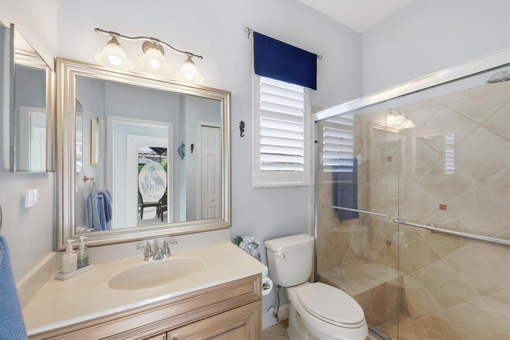 3606 Pennyroyal Road Port Charlotte, FL 33953 - Photo 46 of 96 a bathroom with a sink a toilet and shower