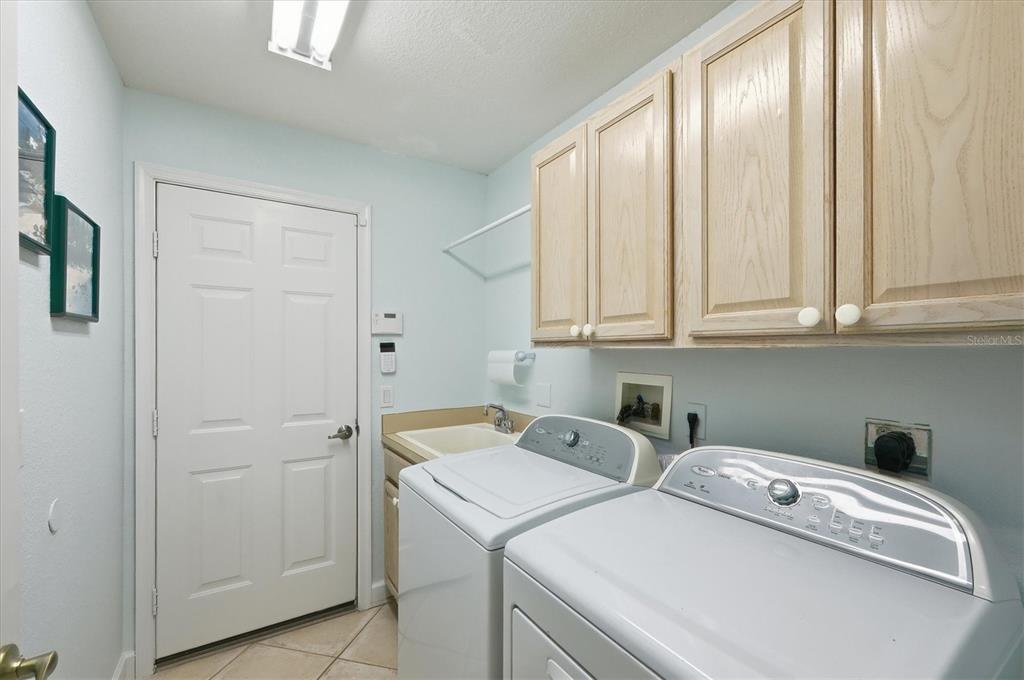 3606 Pennyroyal Road Port Charlotte, FL 33953 - Photo 48 of 96 a utility room with dryer and washer