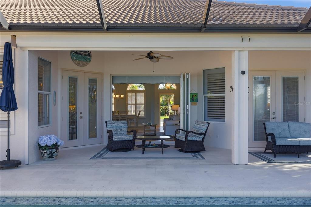 3606 Pennyroyal Road Port Charlotte, FL 33953 - Photo 55 of 96 a living room with furniture a wooden floor and a rug