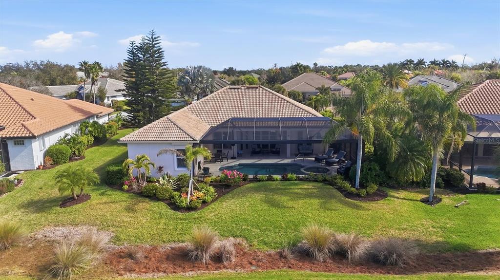 3606 Pennyroyal Road Port Charlotte, FL 33953 - Photo 67 of 96 a view of a house with swimming pool and a yard