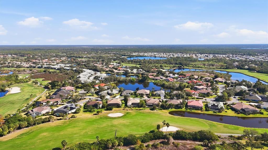 3606 Pennyroyal Road Port Charlotte, FL 33953 - Photo 73 of 96 an aerial view of a city with lots of residential buildings ocean and mountain view in back