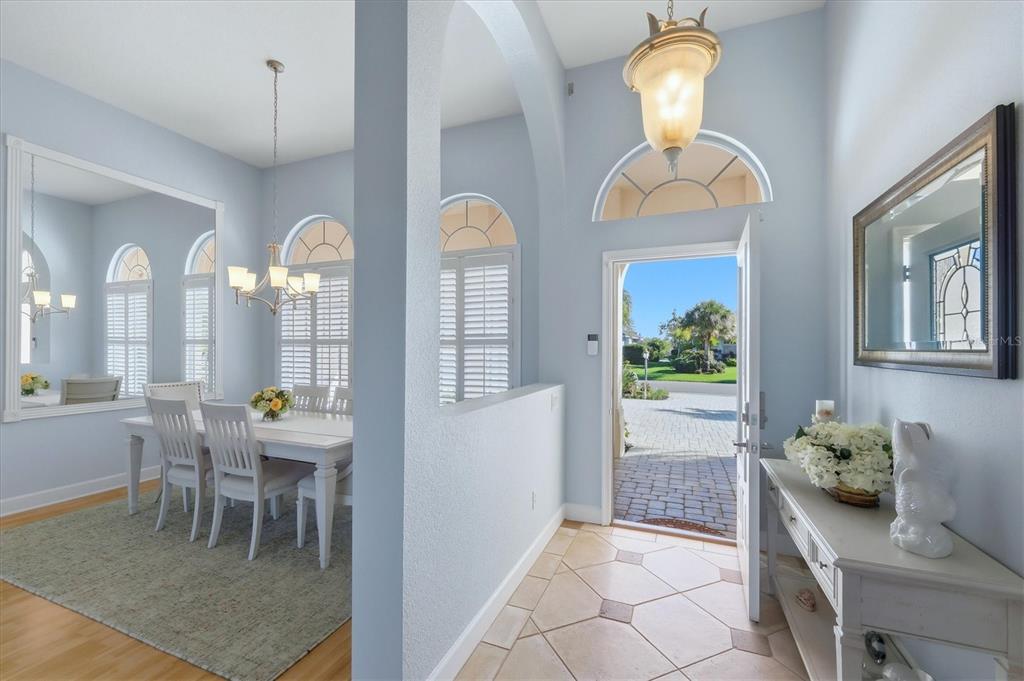 3606 Pennyroyal Road Port Charlotte, FL 33953 - Photo 9 of 96 a view of a dining room with furniture and a chandelier