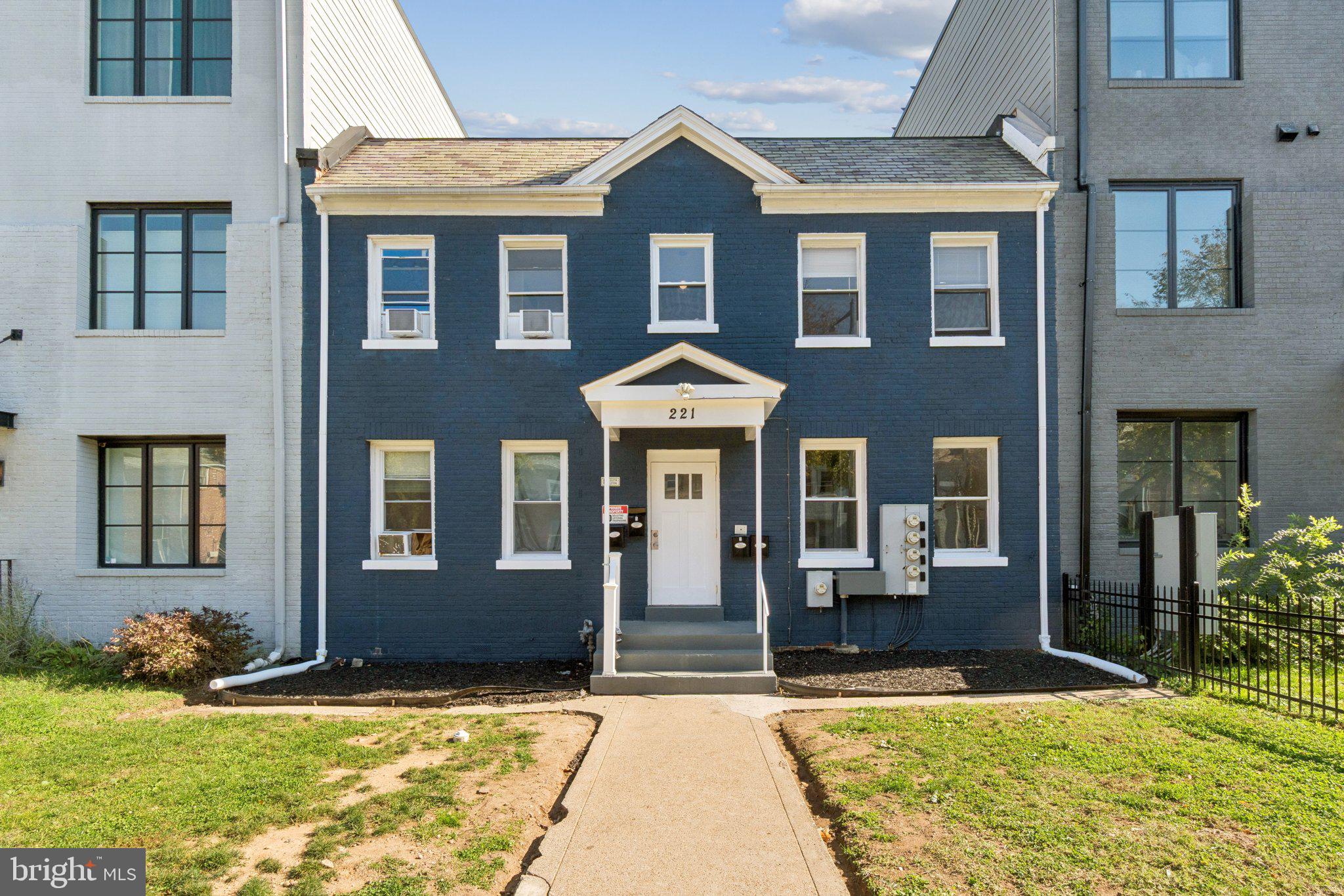 221 20th Street Northeast Washington, DC 20002 - Photo 1 of 26 a front view of a house with yard