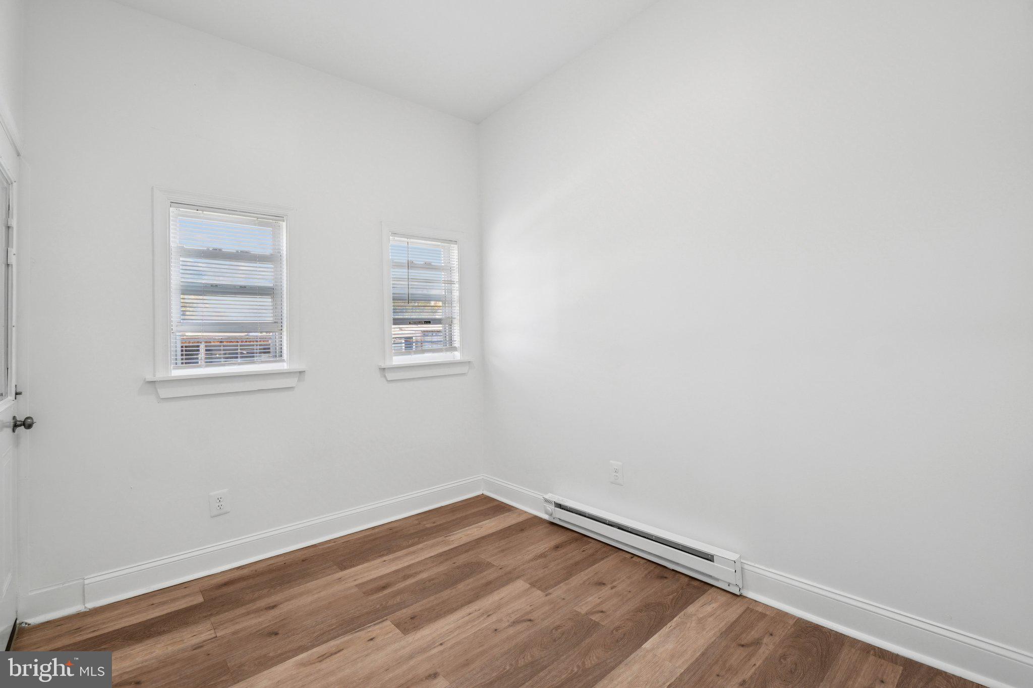 221 20th Street Northeast Washington, DC 20002 - Photo 6 of 26 a view of a room with wooden floor and windows