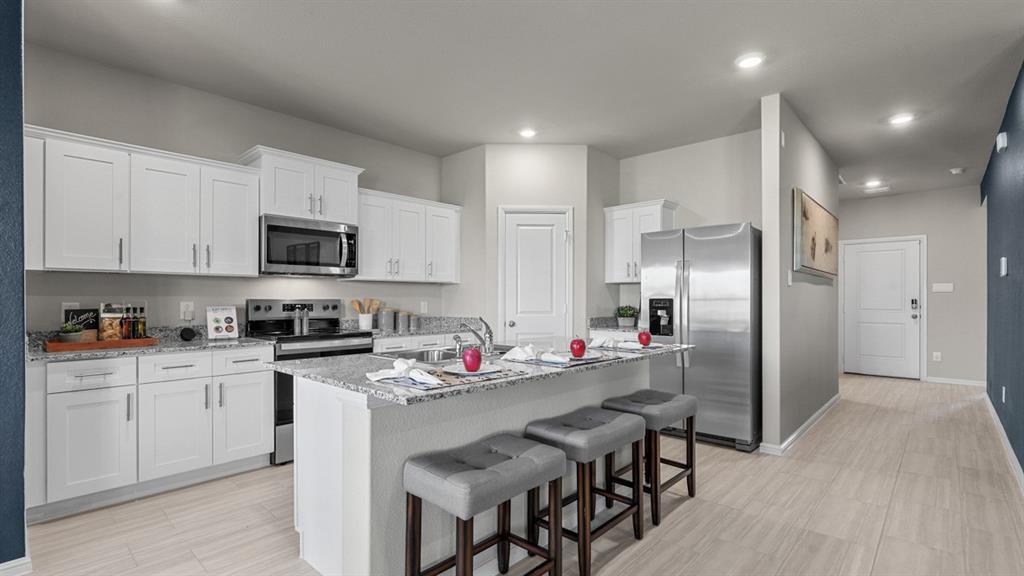 325 Blanco Drive Azle, TX 76020 - Photo 37 of 39 Kitchen-All Home and community information, including pricing, included features, terms, availability and amenities, are subject to change at any time without notice or obligation. All Drawings, pictures, photographs, video, square footages, floor plans, elevations, features, colors and sizes are approximate for illustration purposes only and will vary from the homes as built.