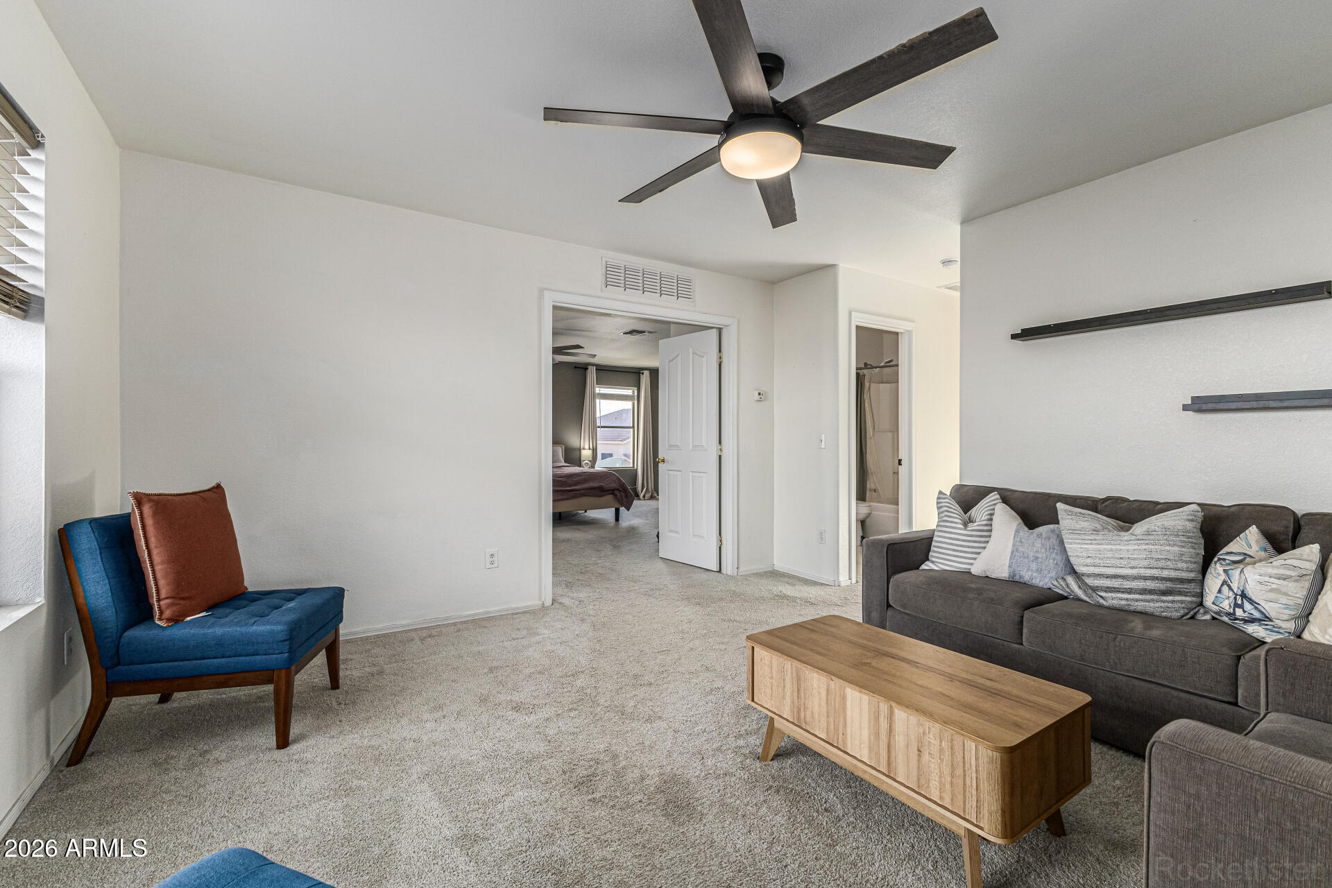 3033 East Santa Rosa Drive Gilbert, AZ 85234 - Photo 14 of 24 a living room with furniture and a ceiling fan