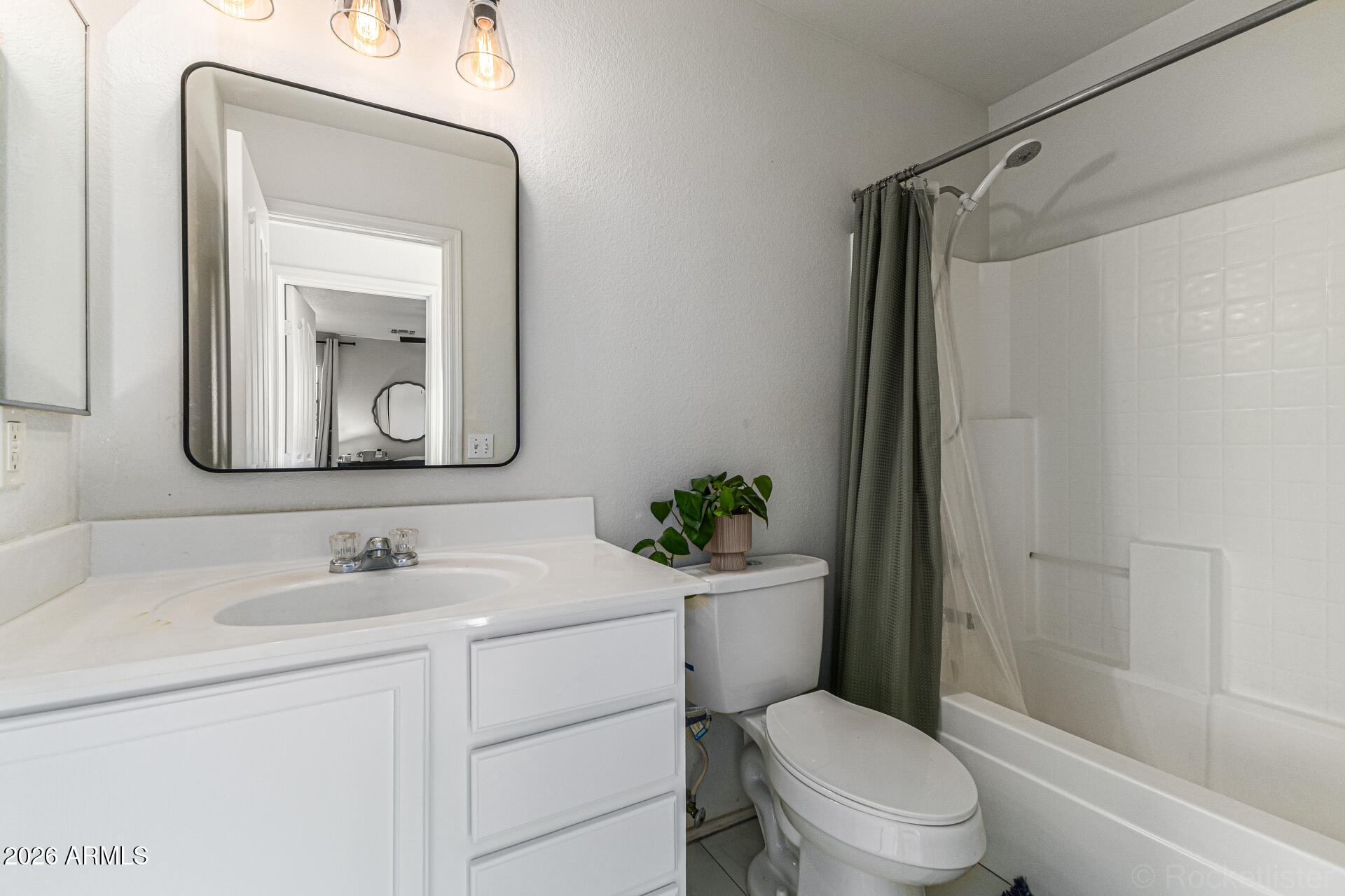 3033 East Santa Rosa Drive Gilbert, AZ 85234 - Photo 17 of 24 a bathroom with a toilet sink vanity tub and shower