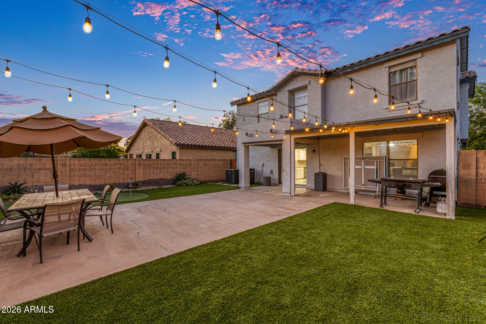 3033 East Santa Rosa Drive Gilbert, AZ 85234 - Photo 22 of 24 a view of a house with a yard and sitting area