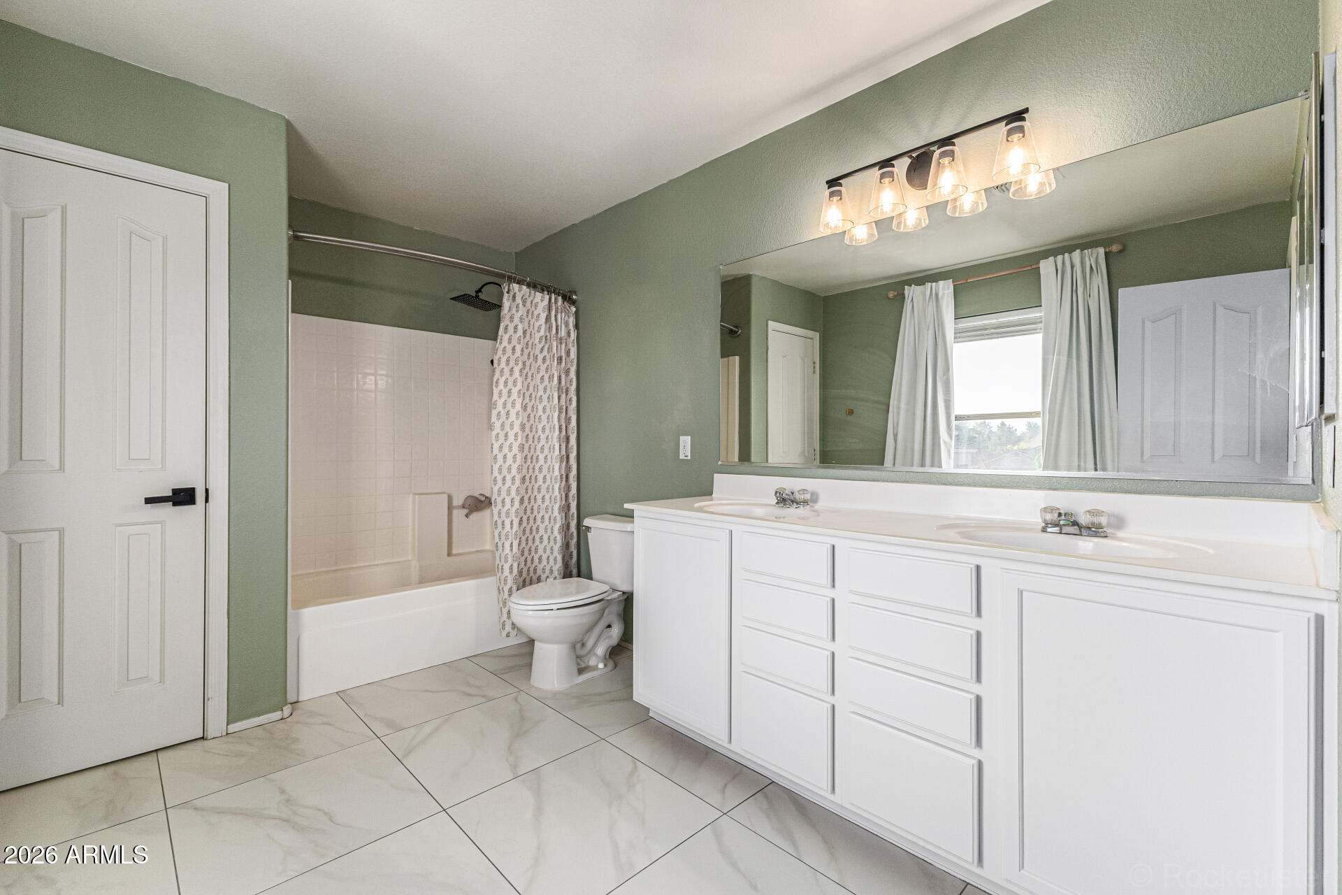 3033 East Santa Rosa Drive Gilbert, AZ 85234 - Photo 4 of 24 a bathroom with a double vanity sink mirror and toilet