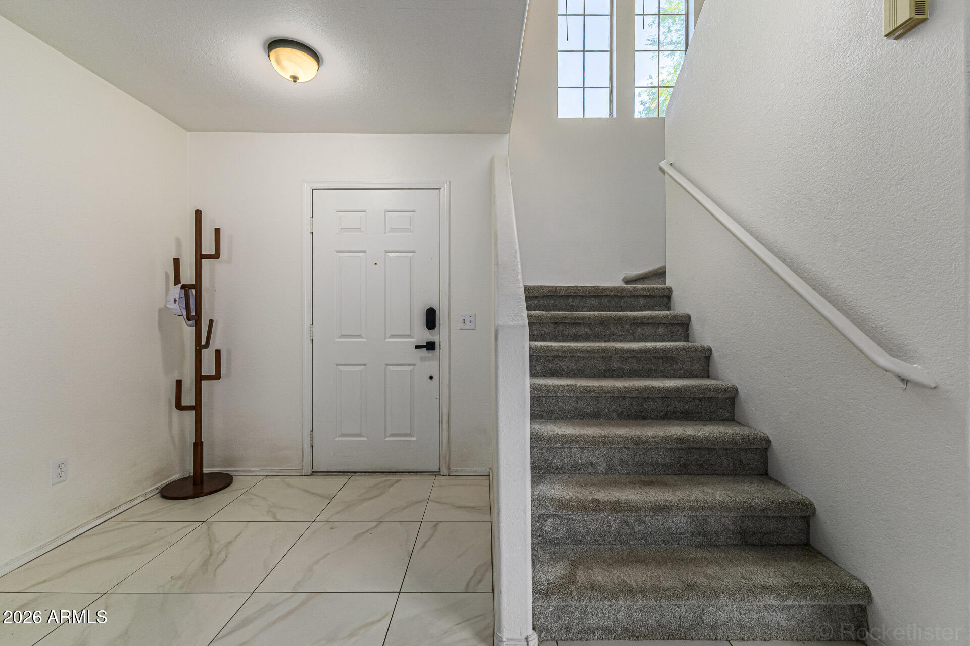 3033 East Santa Rosa Drive Gilbert, AZ 85234 - Photo 6 of 24 a view of an entryway with staircase
