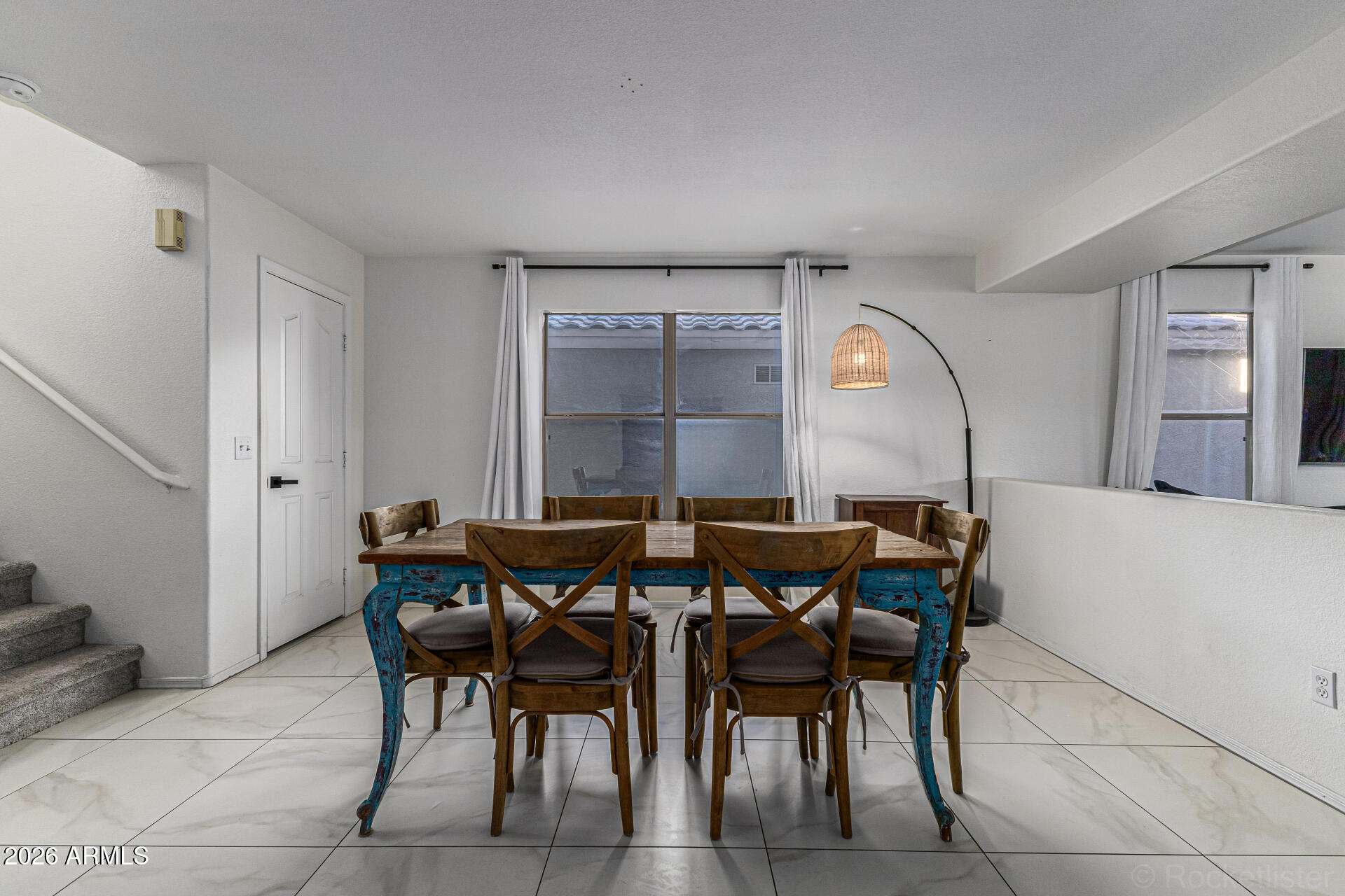 3033 East Santa Rosa Drive Gilbert, AZ 85234 - Photo 7 of 24 a view of a dining room with furniture and window