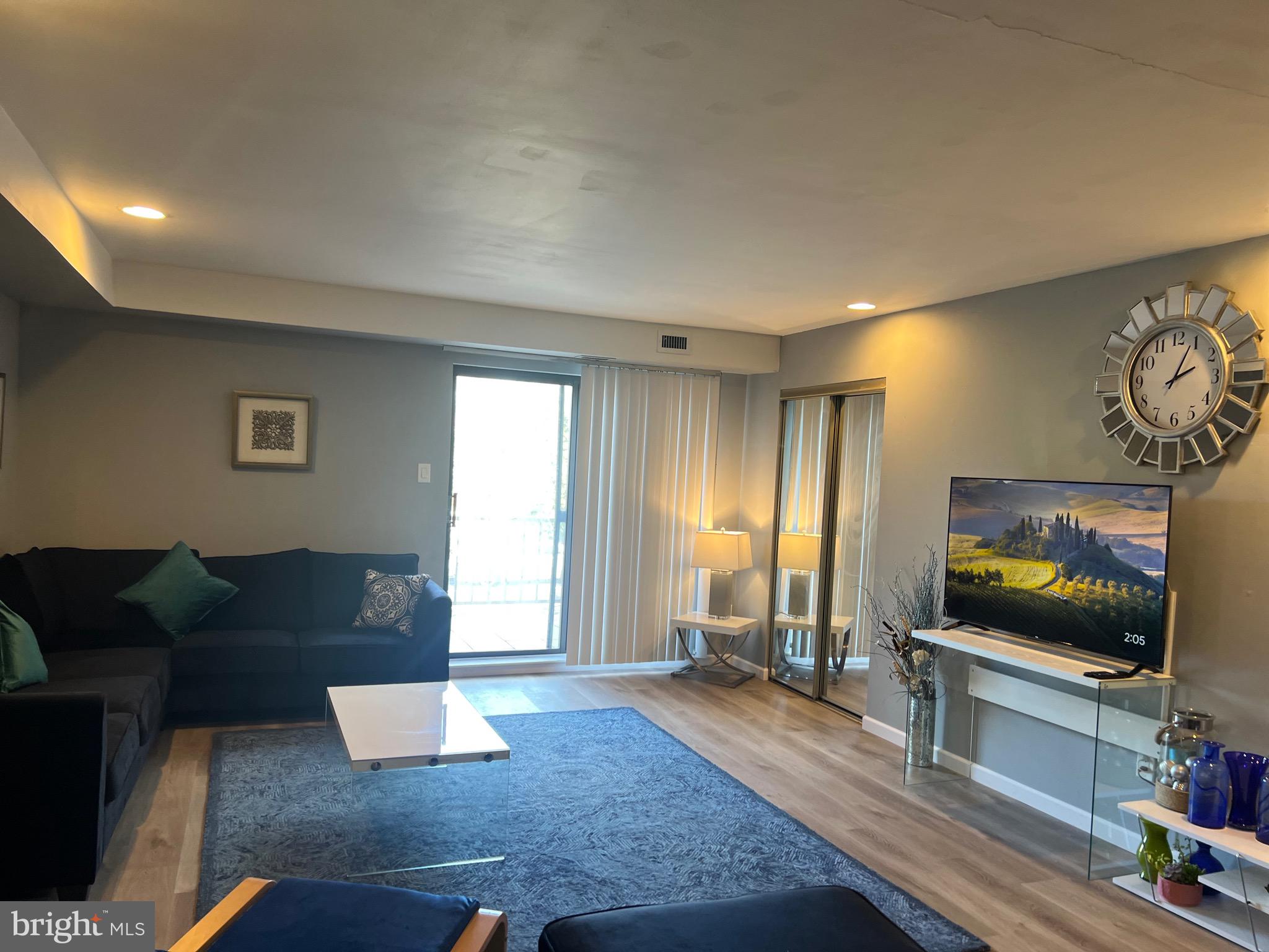 16 Township Line Road Elkins Park, PA 19027 - Photo 17 of 28 a living room with furniture and a flat screen tv