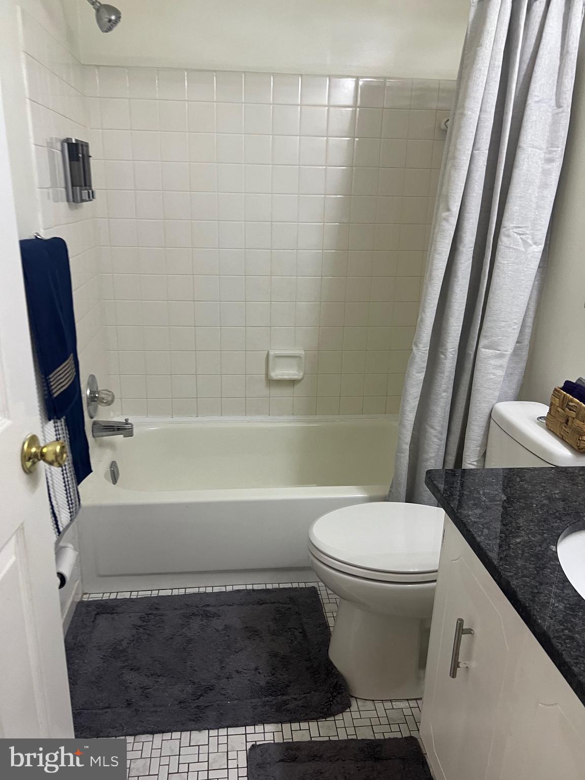 16 Township Line Road Elkins Park, PA 19027 - Photo 19 of 28 a bathroom with a toilet and a bathtub