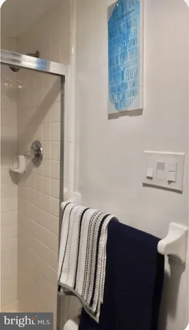 a bathroom with a bathtub and shower