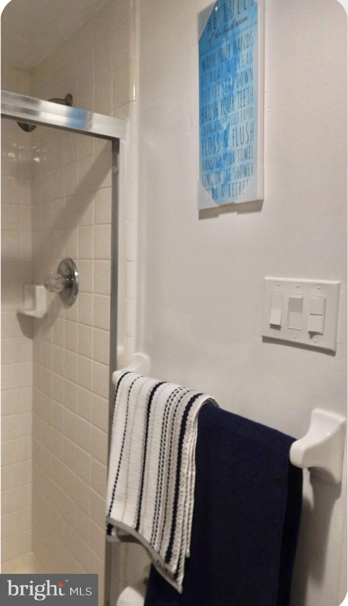 16 Township Line Road Elkins Park, PA 19027 - Photo 26 of 28 a bathroom with a bathtub and shower