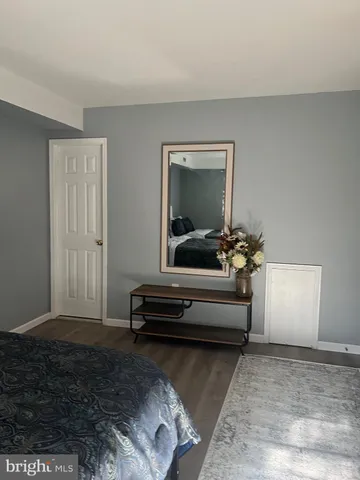 a living room with furniture and a mirror