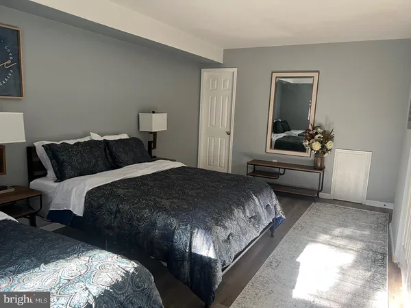 a bedroom with a bed and a couch