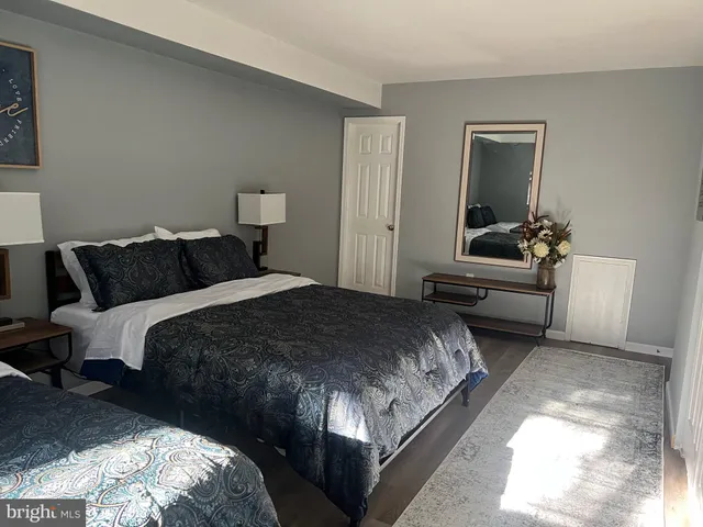 a bedroom with a bed and a couch