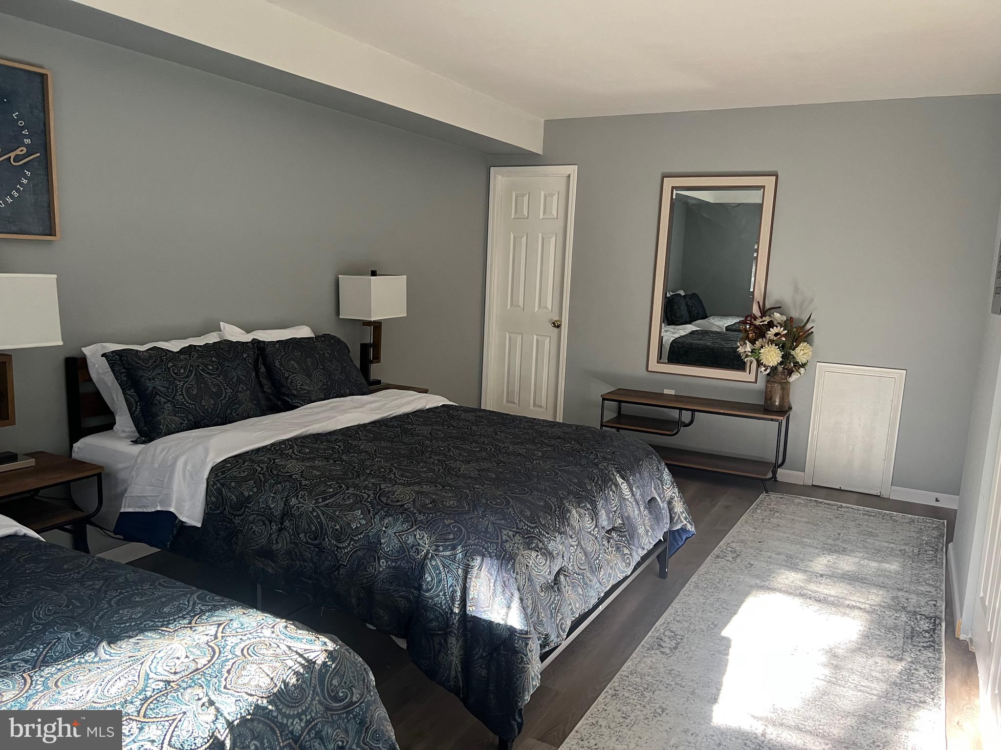 16 Township Line Road Elkins Park, PA 19027 - Photo 4 of 28 a bedroom with a bed and a couch