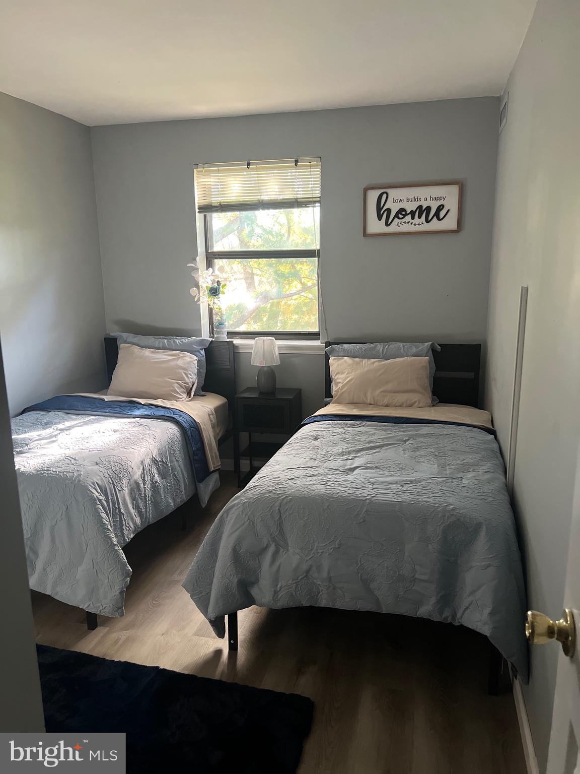 16 Township Line Road Elkins Park, PA 19027 - Photo 9 of 28 a bedroom with two beds and a window