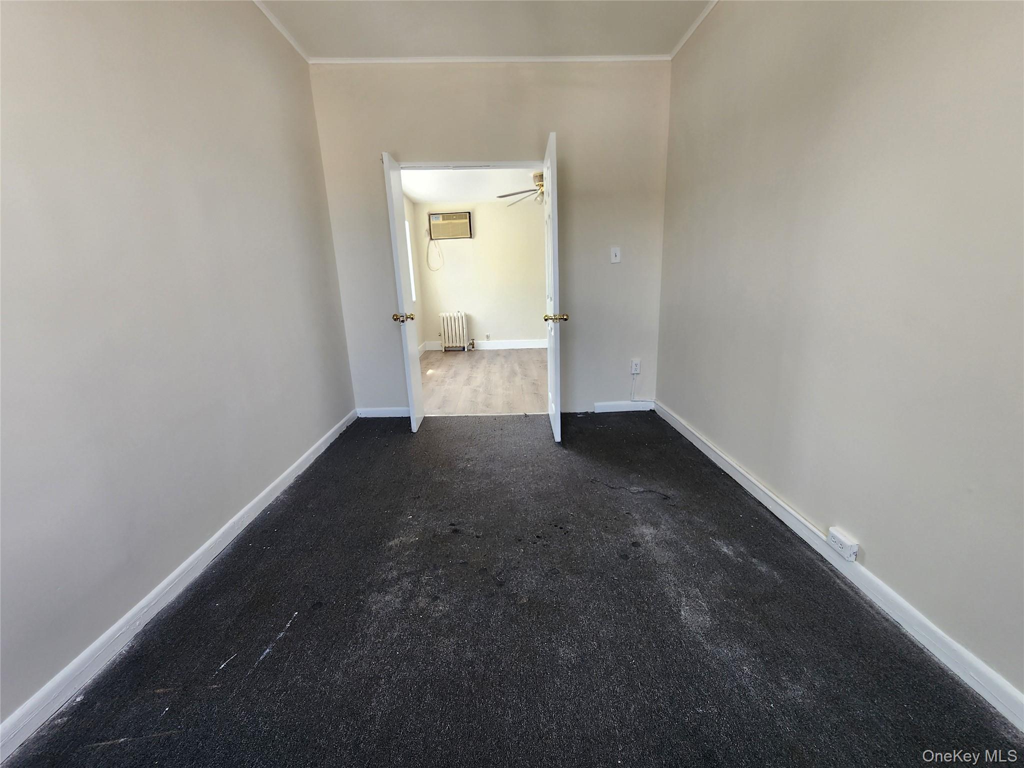 59-12 58th Road Queens, NY 11378 - Photo 20 of 21 a view of a room that has a small window