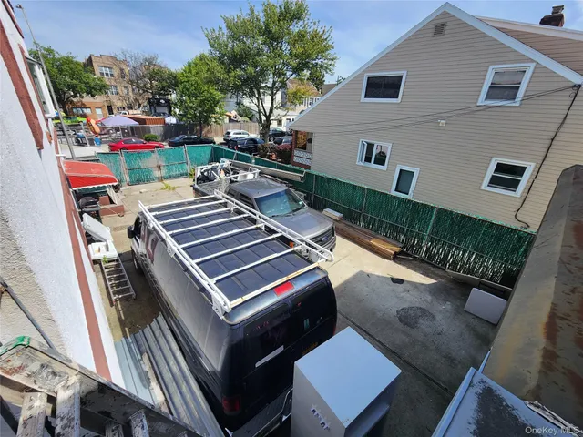 a view of a chairs and table in a balcony