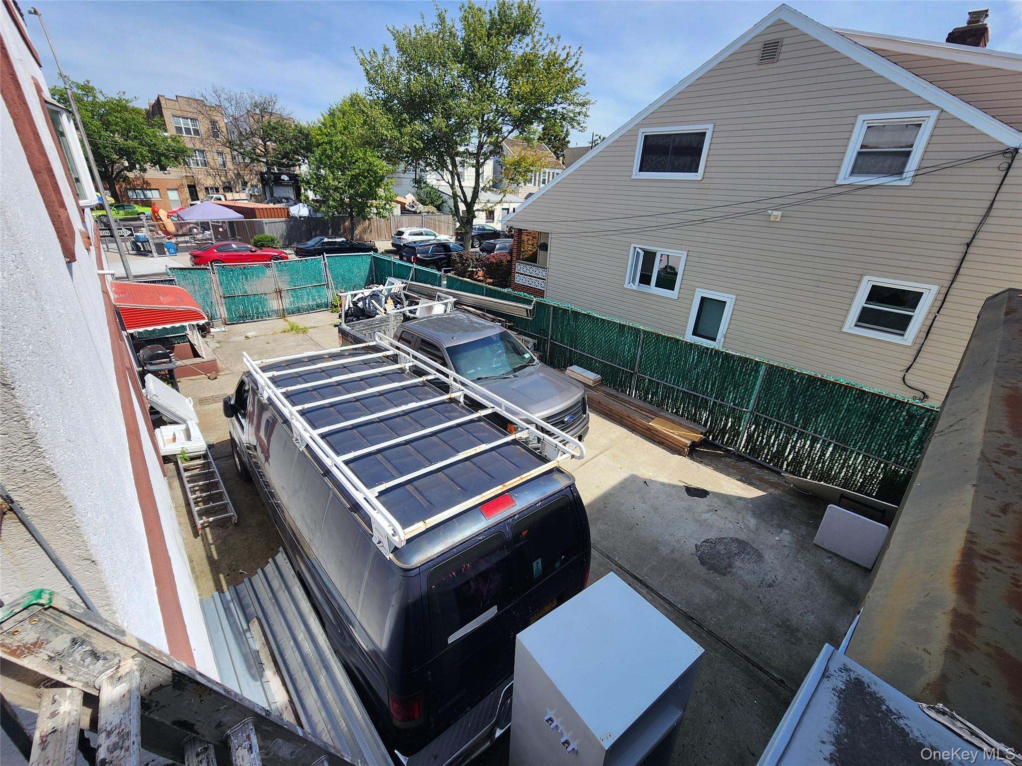 59-12 58th Road Queens, NY 11378 - Photo 3 of 21 a view of a chairs and table in a balcony