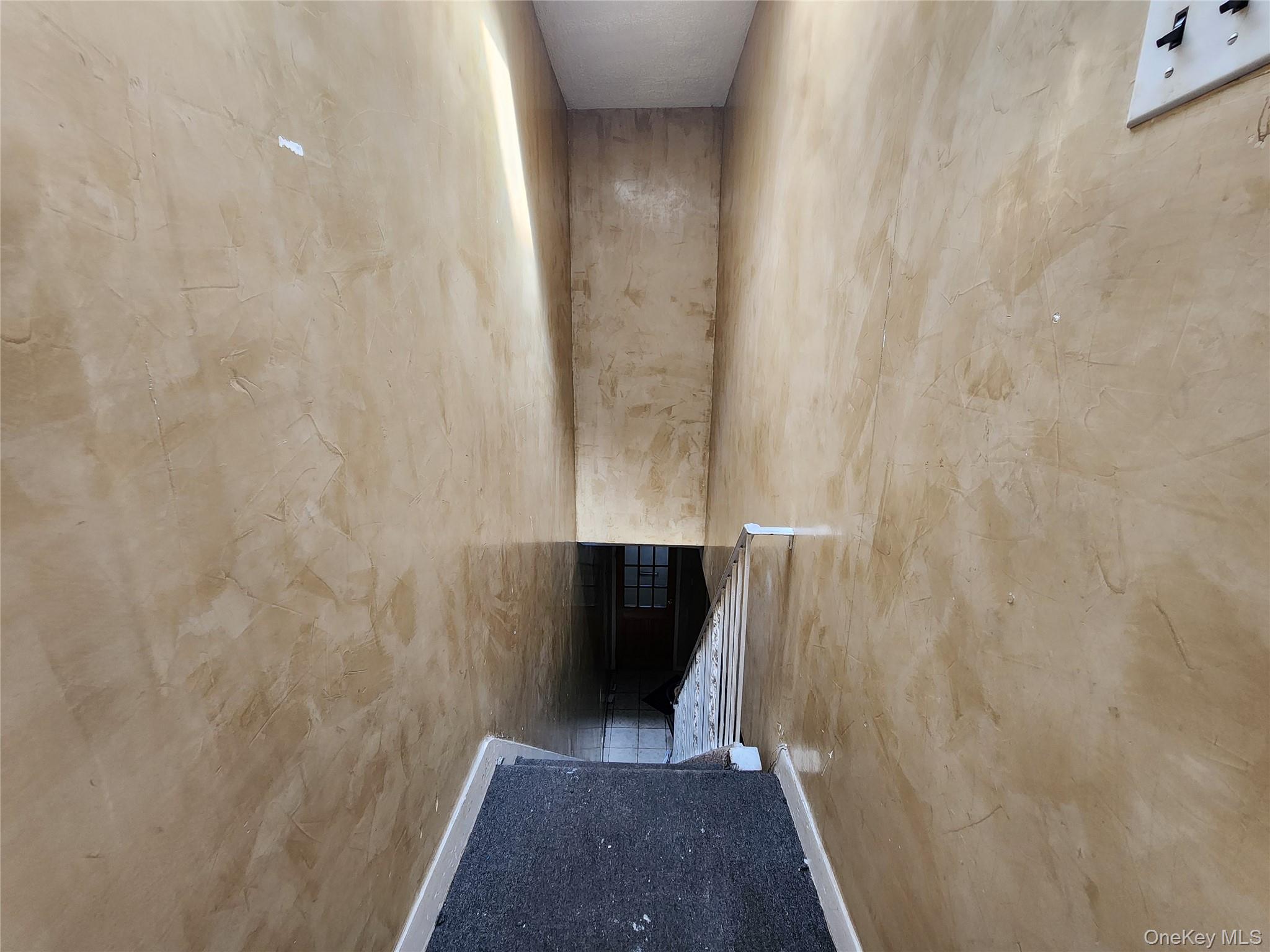 59-12 58th Road Queens, NY 11378 - Photo 5 of 21 a view of hallway with wooden floor