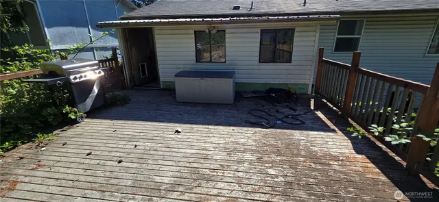 a view of a backyard both side of the house