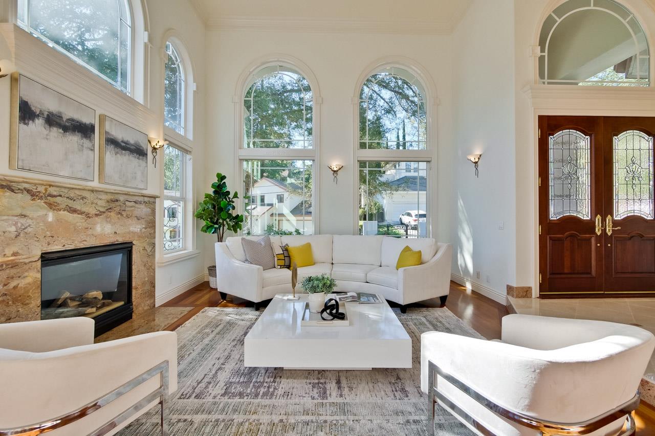 10935 Miramonte Road Cupertino, CA 95014 - Photo 13 of 71 a living room with furniture fireplace and a large window