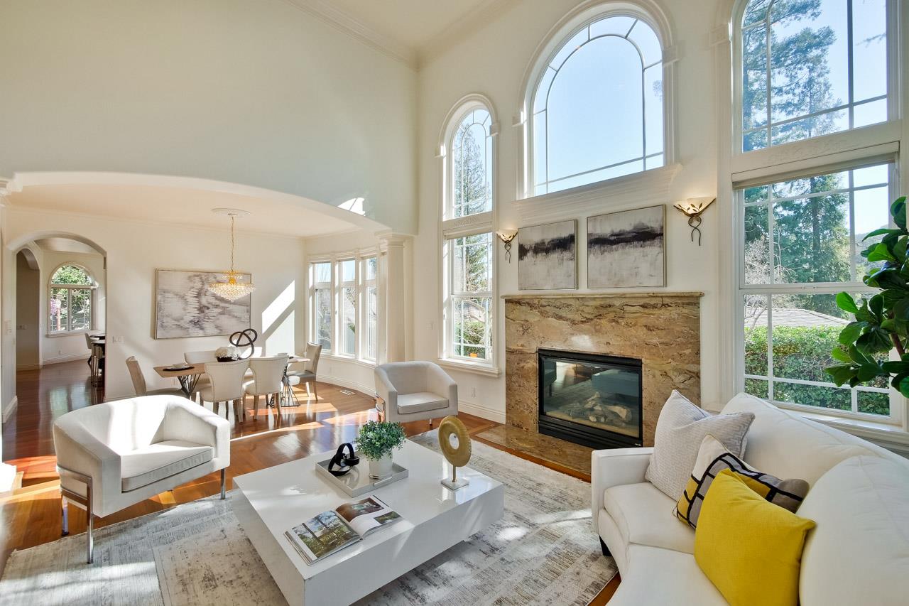 10935 Miramonte Road Cupertino, CA 95014 - Photo 14 of 71 a living room with furniture a fireplace and a large window