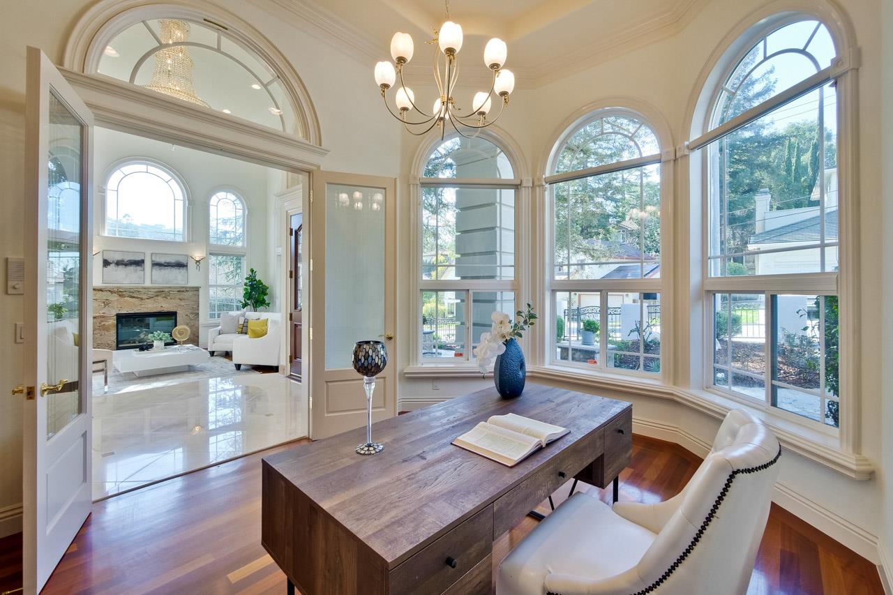 10935 Miramonte Road Cupertino, CA 95014 - Photo 15 of 71 a living room with furniture a chandelier and a large window