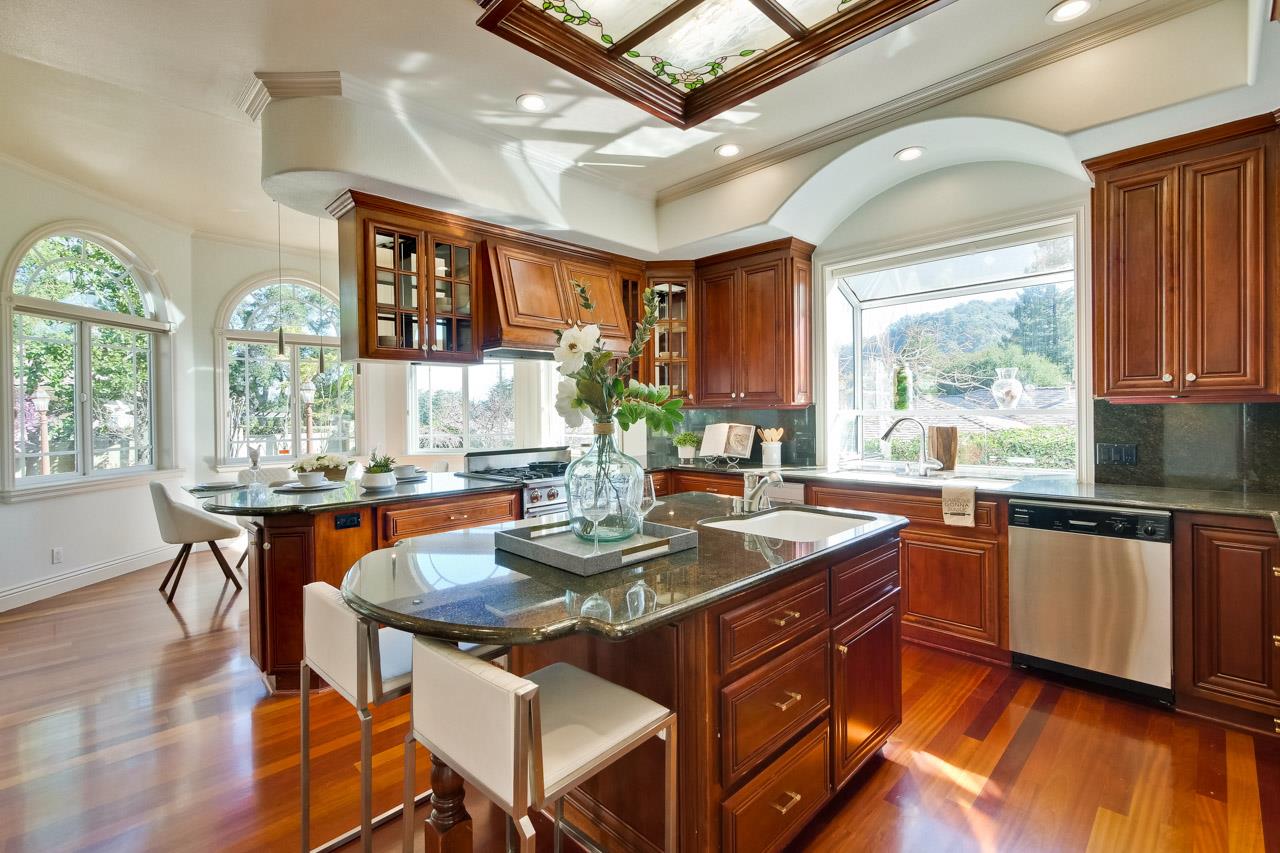 10935 Miramonte Road Cupertino, CA 95014 - Photo 23 of 71 a kitchen with stainless steel appliances granite countertop a stove a sink dishwasher and cabinets with wooden floor