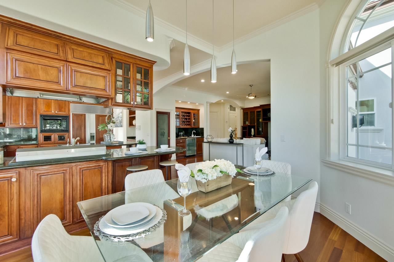 10935 Miramonte Road Cupertino, CA 95014 - Photo 25 of 71 a dining room with furniture a large window and stainless steel appliances