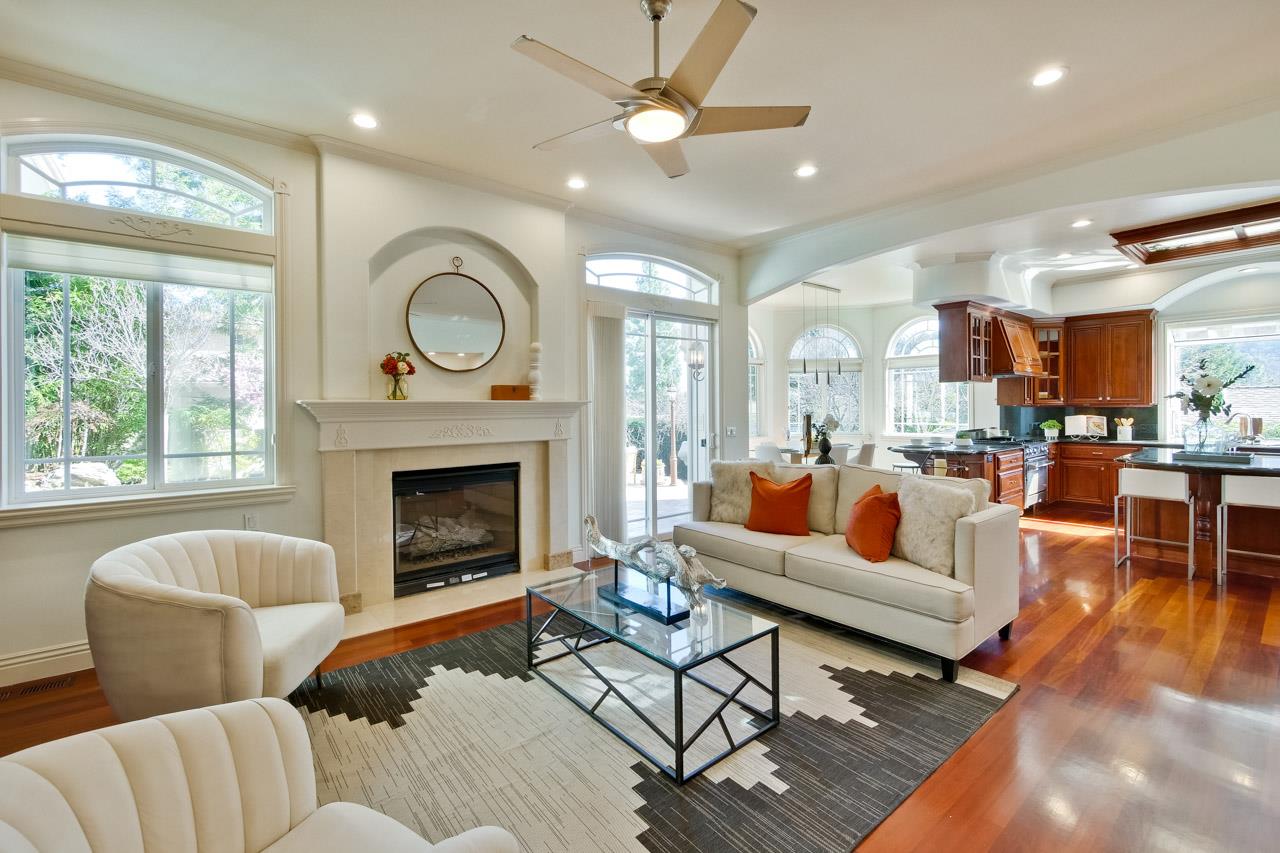 10935 Miramonte Road Cupertino, CA 95014 - Photo 27 of 71 a living room with furniture and a fireplace