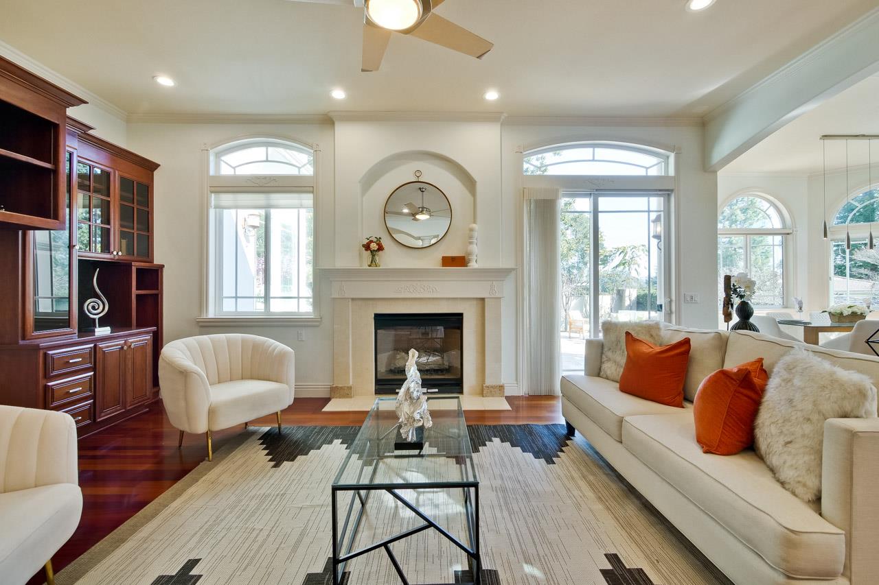 10935 Miramonte Road Cupertino, CA 95014 - Photo 28 of 71 a living room with furniture and a fireplace
