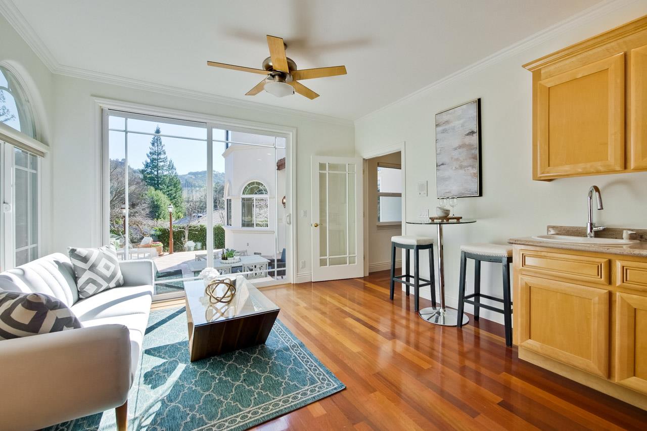 10935 Miramonte Road Cupertino, CA 95014 - Photo 34 of 71 a living room with furniture wooden floor and a large window