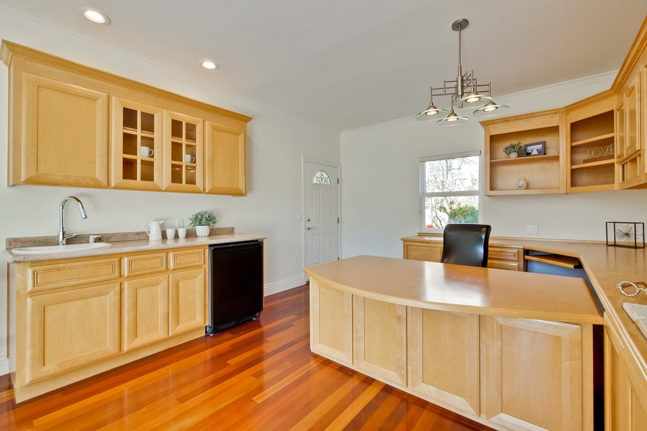 10935 Miramonte Road Cupertino, CA 95014 - Photo 35 of 71 a kitchen with stainless steel appliances granite countertop a sink dishwasher a stove and a dining table with wooden floor