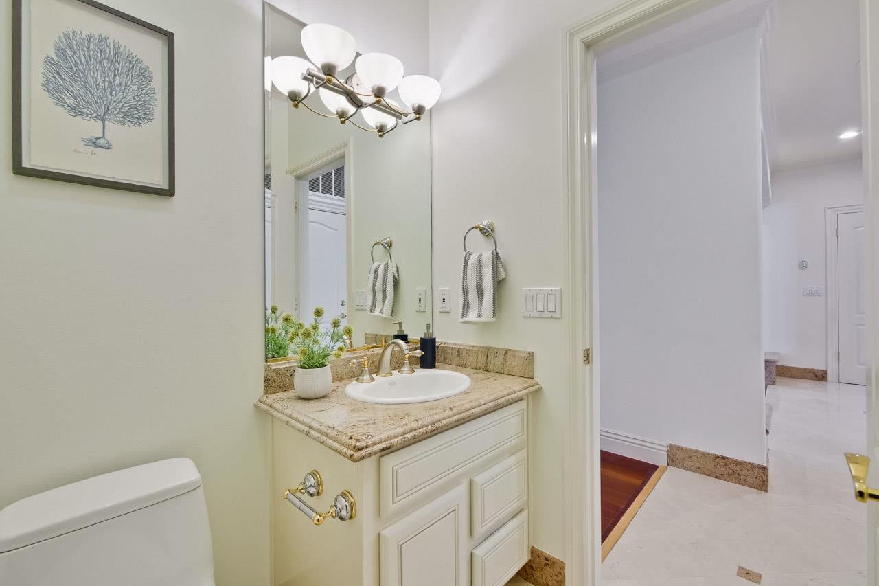 10935 Miramonte Road Cupertino, CA 95014 - Photo 36 of 71 a bathroom with a sink and a mirror