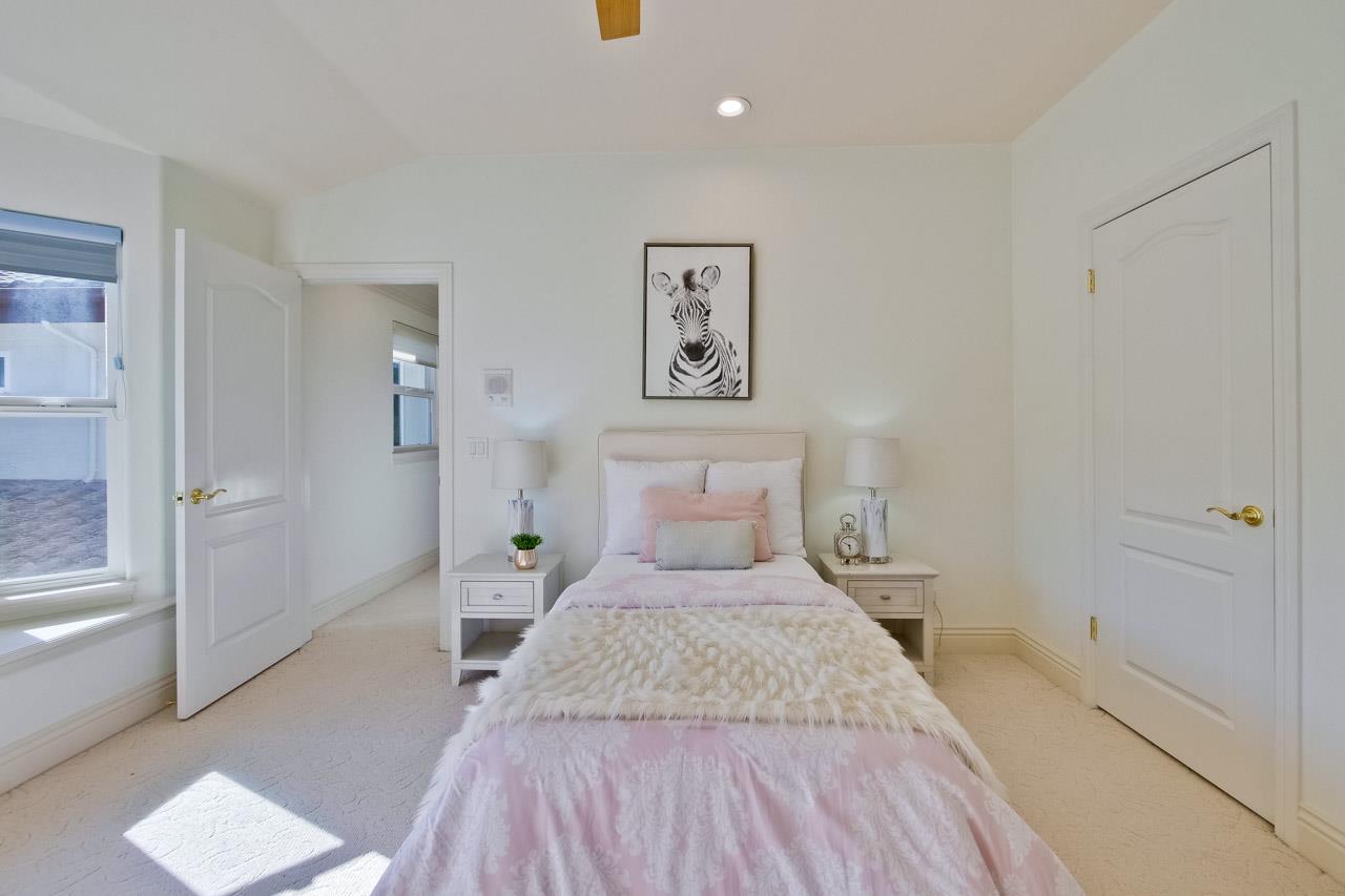 10935 Miramonte Road Cupertino, CA 95014 - Photo 48 of 71 a bedroom with a bed and painting on the wall