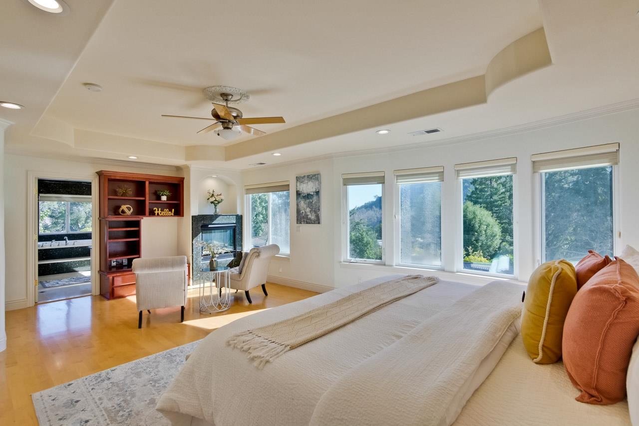 10935 Miramonte Road Cupertino, CA 95014 - Photo 53 of 71 a spacious bedroom with a large bed and a large window