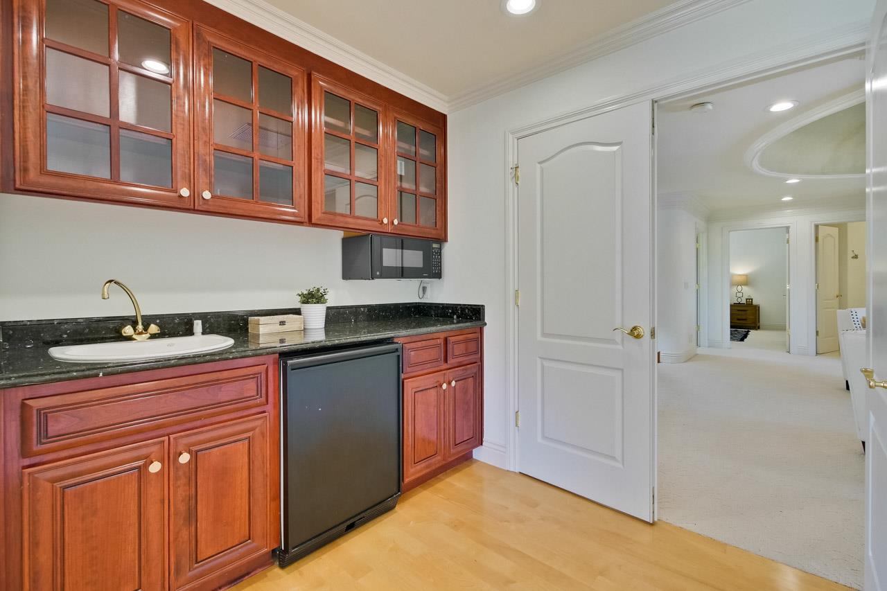 10935 Miramonte Road Cupertino, CA 95014 - Photo 56 of 71 a kitchen with stainless steel appliances granite countertop a sink and cabinets