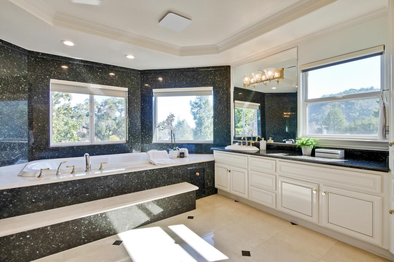 10935 Miramonte Road Cupertino, CA 95014 - Photo 59 of 71 a large bathroom with a large tub and sink