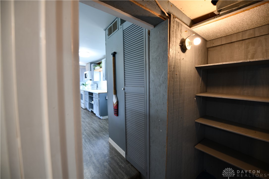 5445 Behm Road, Unit 15 Celina, OH 45822 - Photo 26 of 49 This cozy pantry features practical shelving and convenient access to the kitchen area.